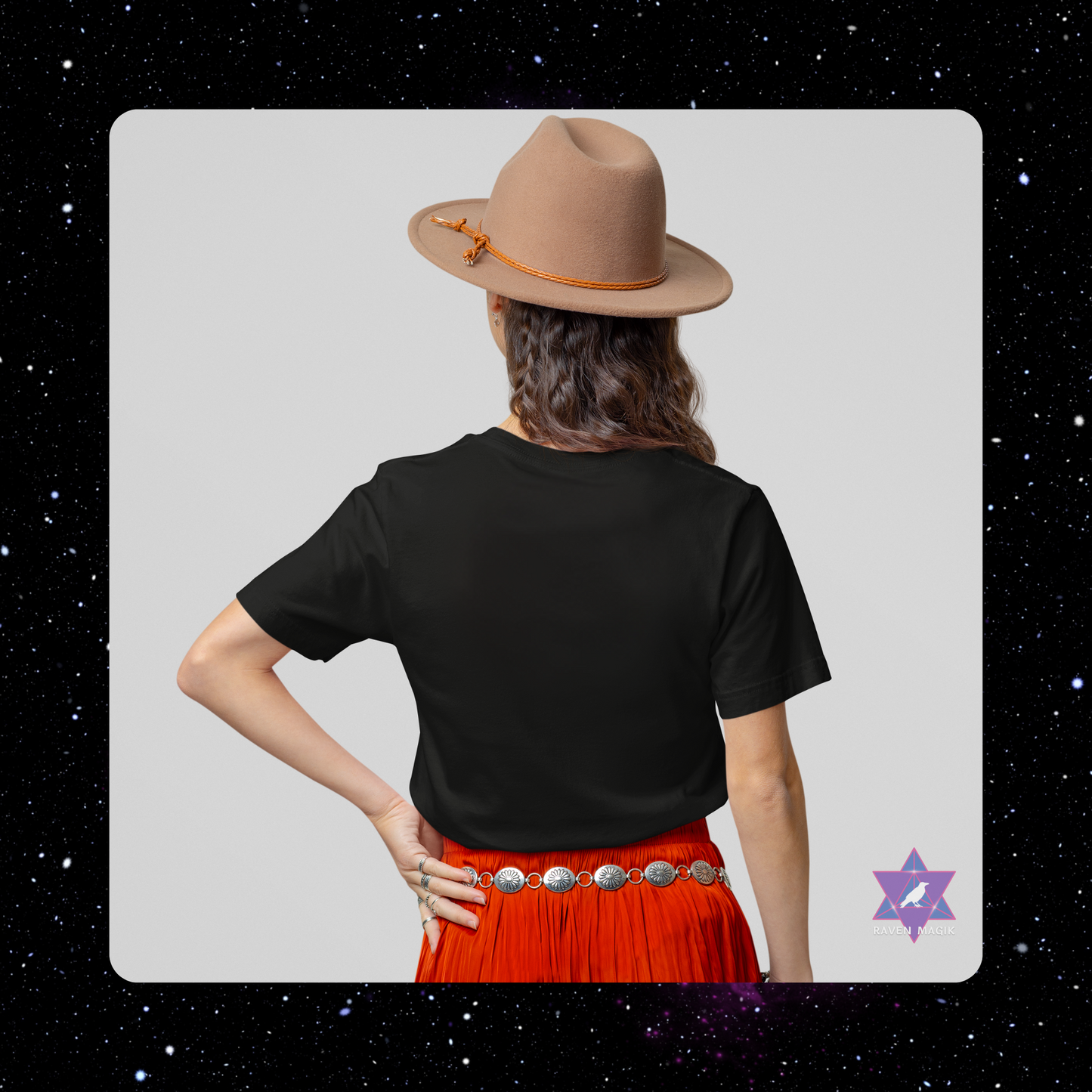 Person wearing a black t-shirt and red skirt with a beige hat on a gray background