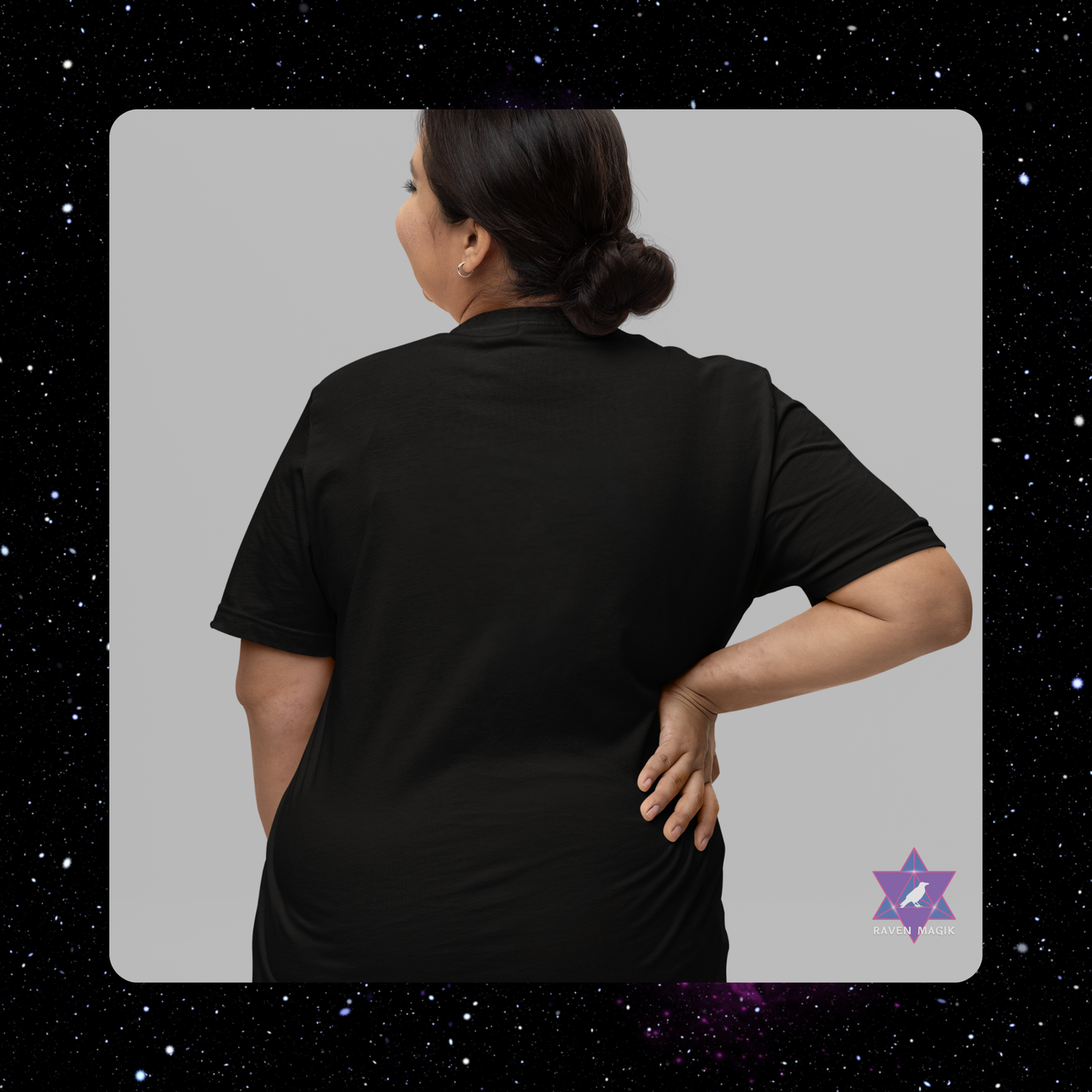 Person wearing a black shirt with a star-like logo on a dark space-themed background.