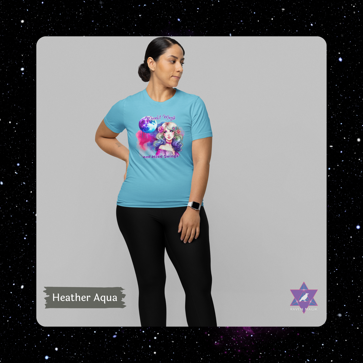 Woman wearing a blue t-shirt with a colorful graphic design on a gray background. Cancer Archetype T-shirt with “Moonlit Magik and Mood Swings” slogan, styled for intuitive, emotional energy and lunar mystique.