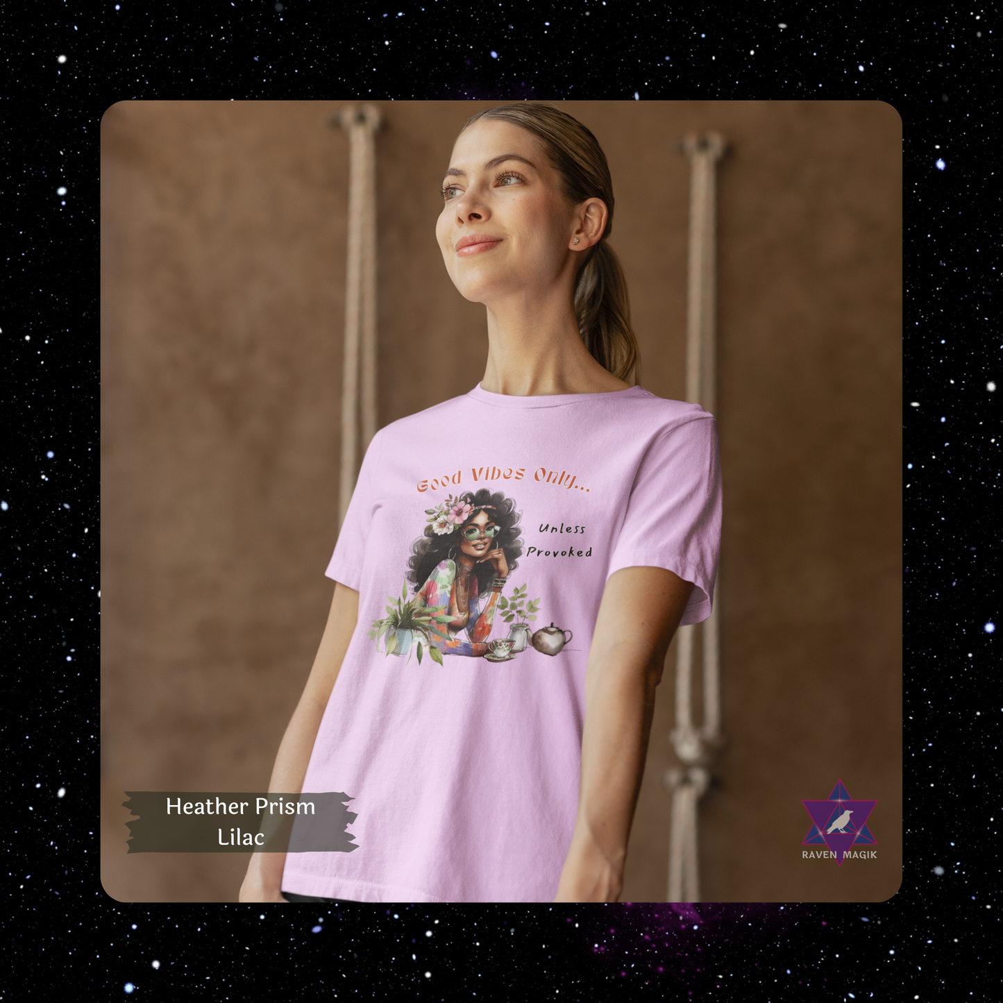 Woman wearing a Heather Prism Lilac t-shirt with a graphic design, standing against a brown background. Gemini Archetype T-shirt with “Good Vibes Only… Unless Provoked” slogan, styled for expressive, unpredictable energy and dual-natured charm.