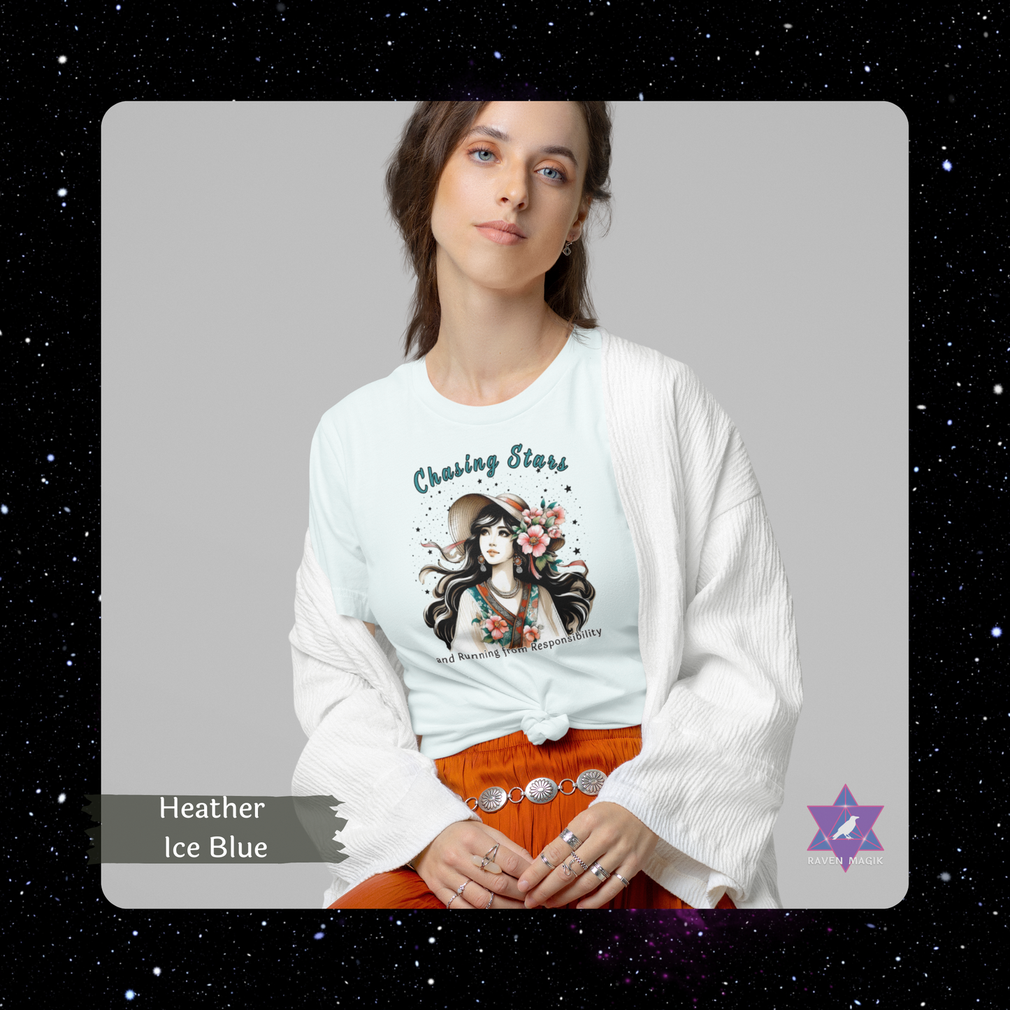 Woman wearing a white sweater over a Heather Ice Blue t-shirt with a graphic design and text, sitting against a gray background. Sagittarius Archetype T-shirt with “Chasing Stars and Running from Responsibility” slogan, styled for adventurous, freedom-loving energy and cosmic wanderlust.