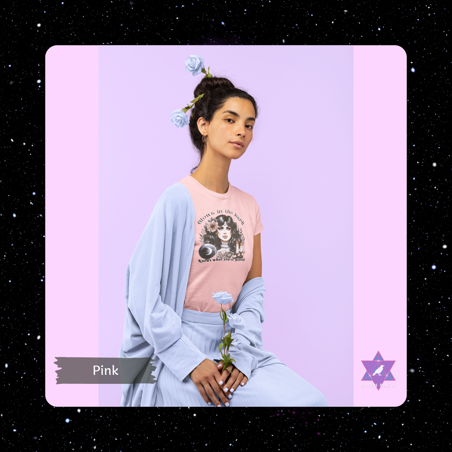 Woman wearing a pink t-shirt with a graphic design on a purple background. Scorpio Archetype T-shirt with “Glows in the Dark and Knows What You’re Hiding” slogan, styled for mysterious, magnetic energy and shadowy charm.
