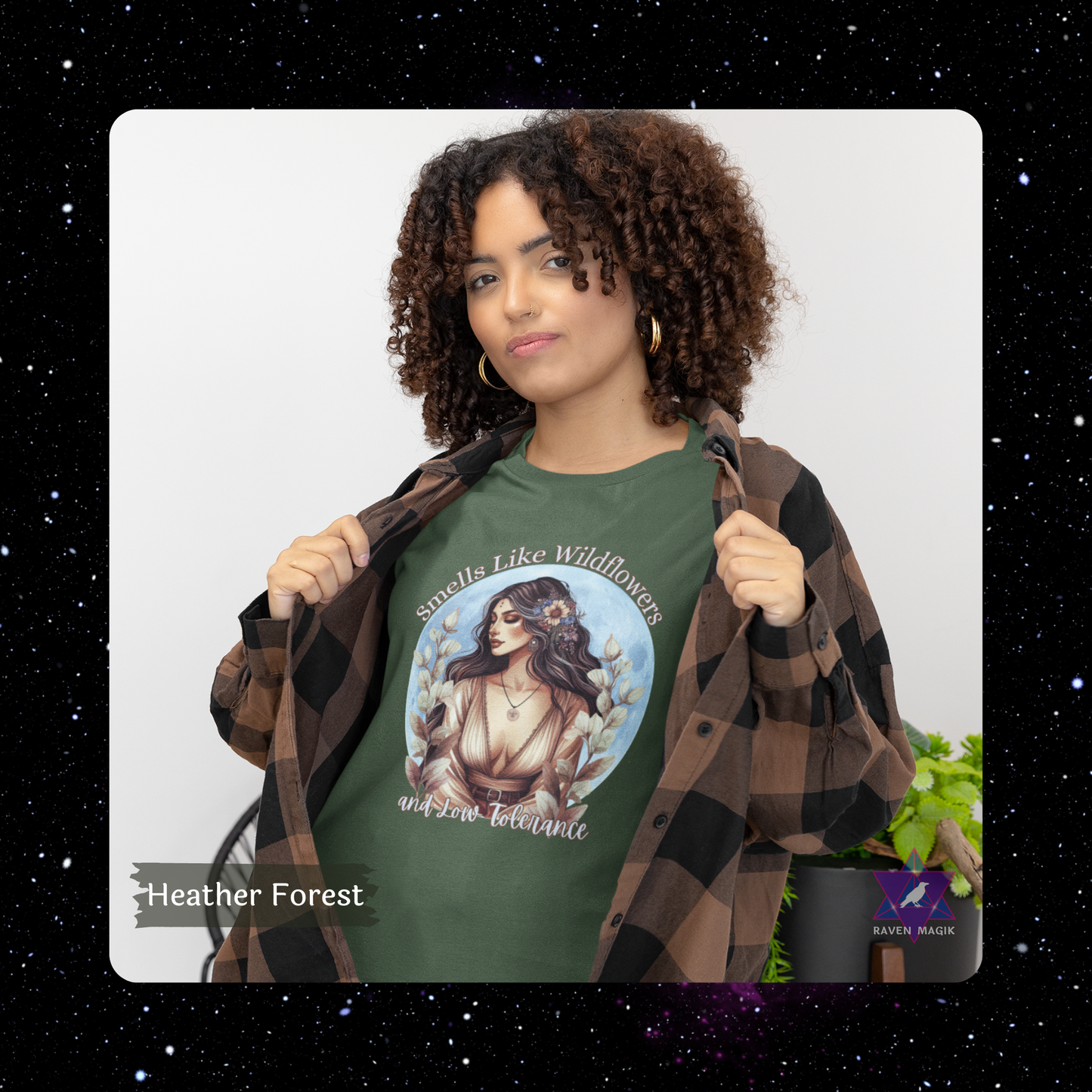 Woman wearing a green t-shirt with a nature-themed design and text, standing against a white background. Taurus Archetype T-shirt with “Smells Like Wildflowers and Low Tolerance” slogan, styled for grounded, sensual energy and earthy elegance.