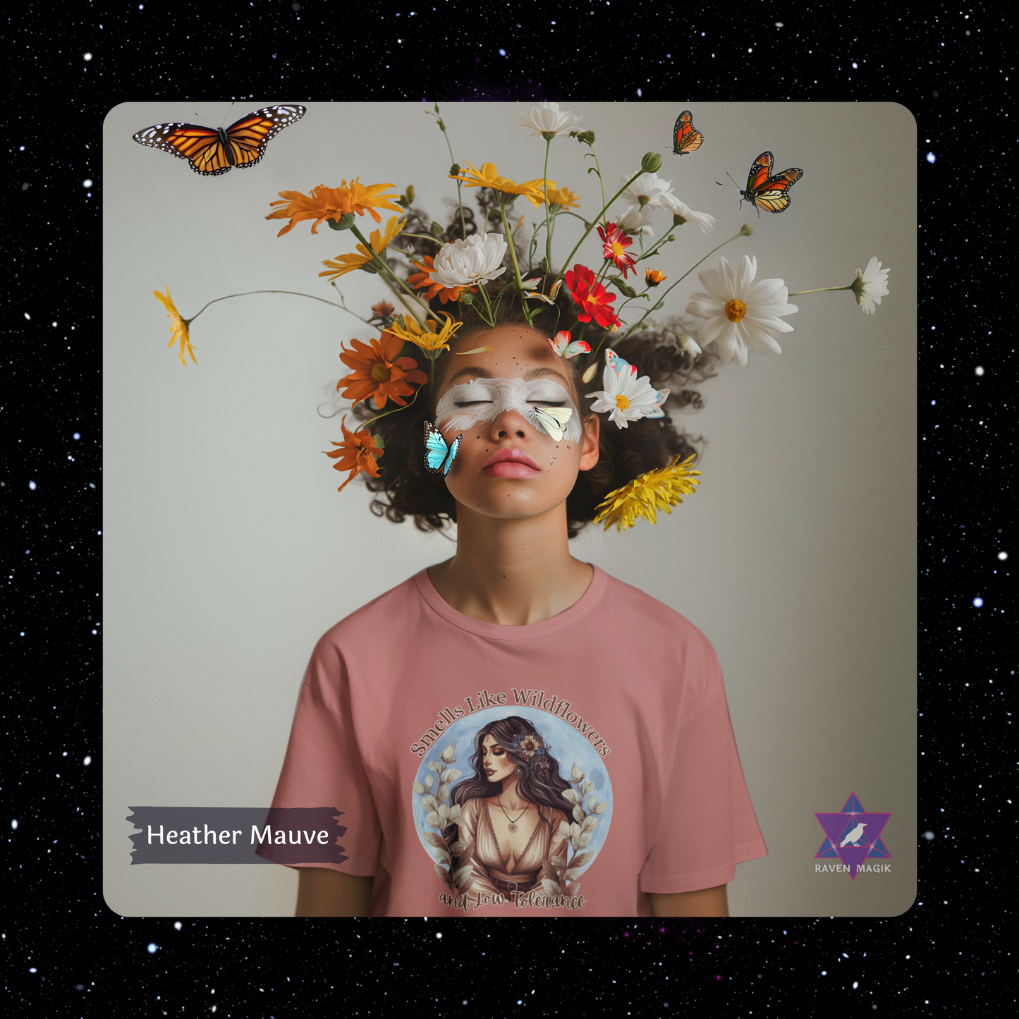 Person wearing a Heather Mauve t-shirt with a floral and butterfly design, against a starry night sky.