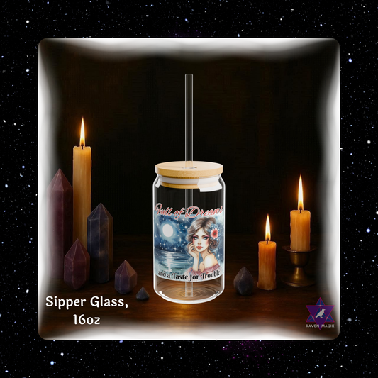 Glass jar with a straw and label on a dark background with candles and crystals