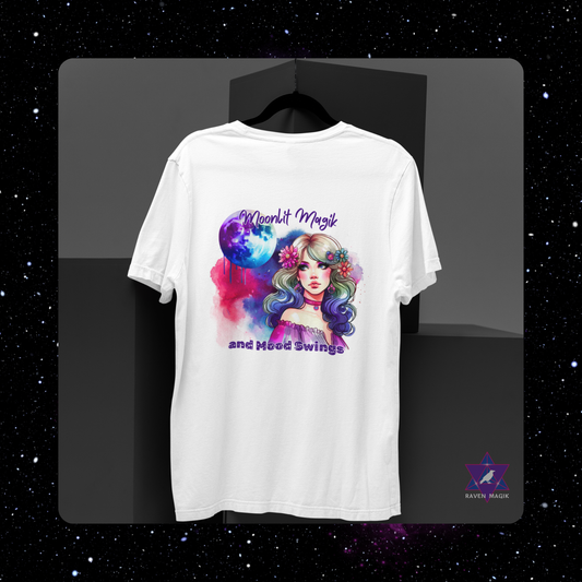 White t-shirt with a colorful graphic design of a woman with flowers in her hair on a black background. Cancer Zodiac T-shirt with “Moonlit Magik and Mood Swings” slogan, styled for intuitive, emotional energy.