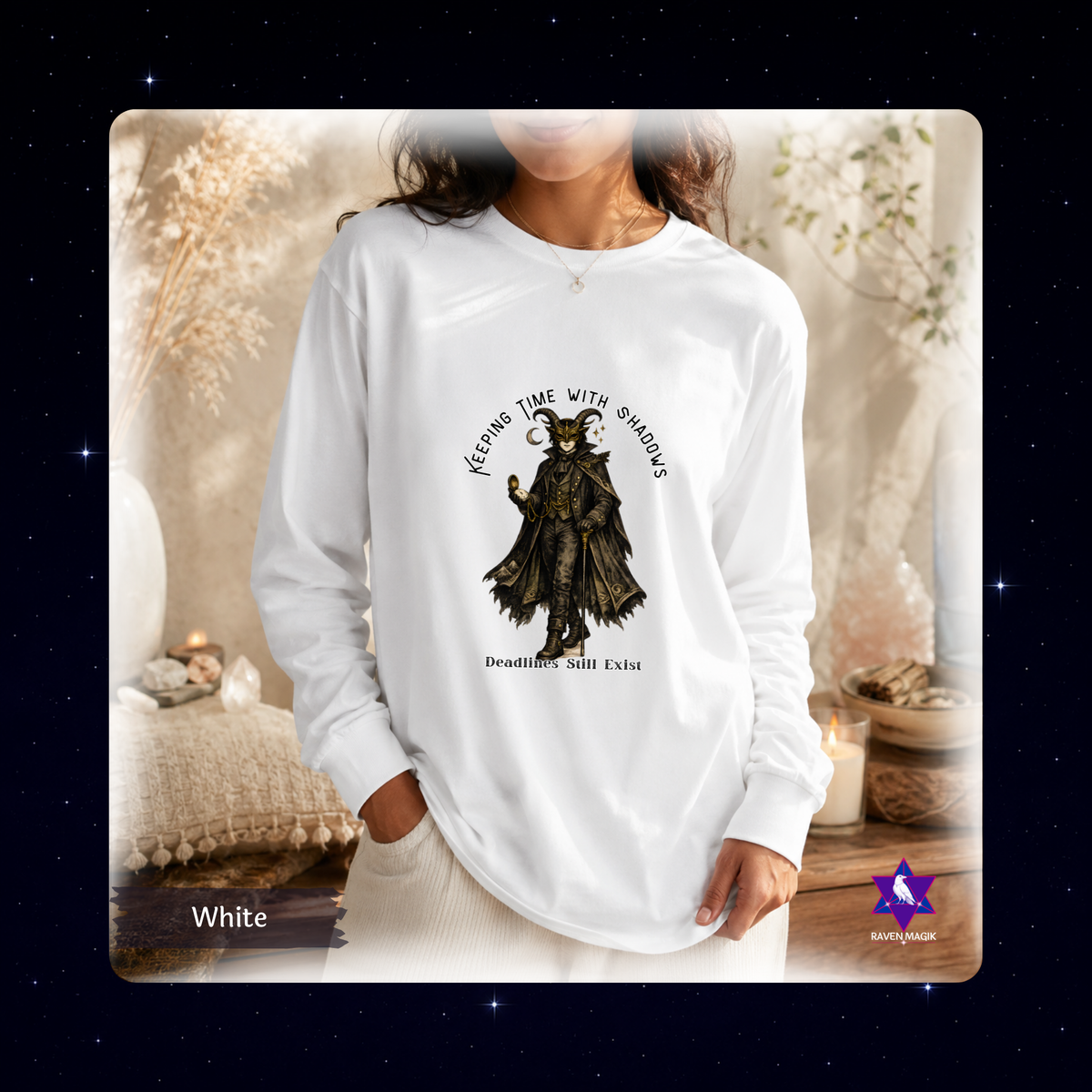 White: Capricorn-inspired vintage masquerade long sleeve shirt in white with pocket watch, horned headpiece, and earthy artwork reading “Keeping Time with Shadows / Deadlines Still Exist.”