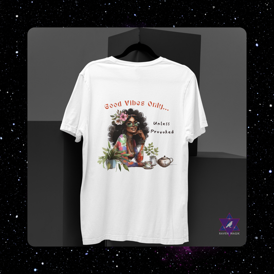 White t-shirt with a graphic design of a woman with flowers and text on a black background. Gemini Zodiac T-shirt with “Good Vibes Only – Unless Provoked” slogan, styled for playful, expressive energy.