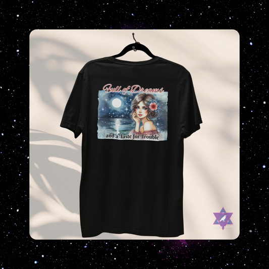 Black t-shirt with a graphic design of a woman with a flower in her hair against a starry background. Pisces Archetype T-shirt with “Full of Dreams and a Taste for Trouble” slogan, styled for intuitive, whimsical energy and poetic rebellion.