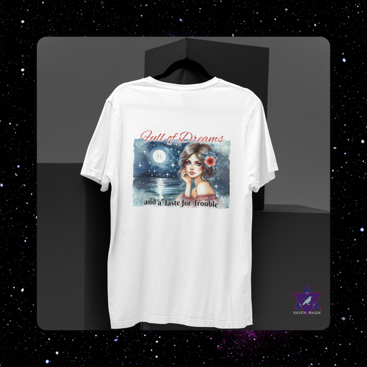 White t-shirt with a graphic design featuring a woman's face and text on a black background. Pisces Zodiac T-shirt with “Full of Dreams and a Taste for Trouble” slogan, styled for whimsical, empathic energy.