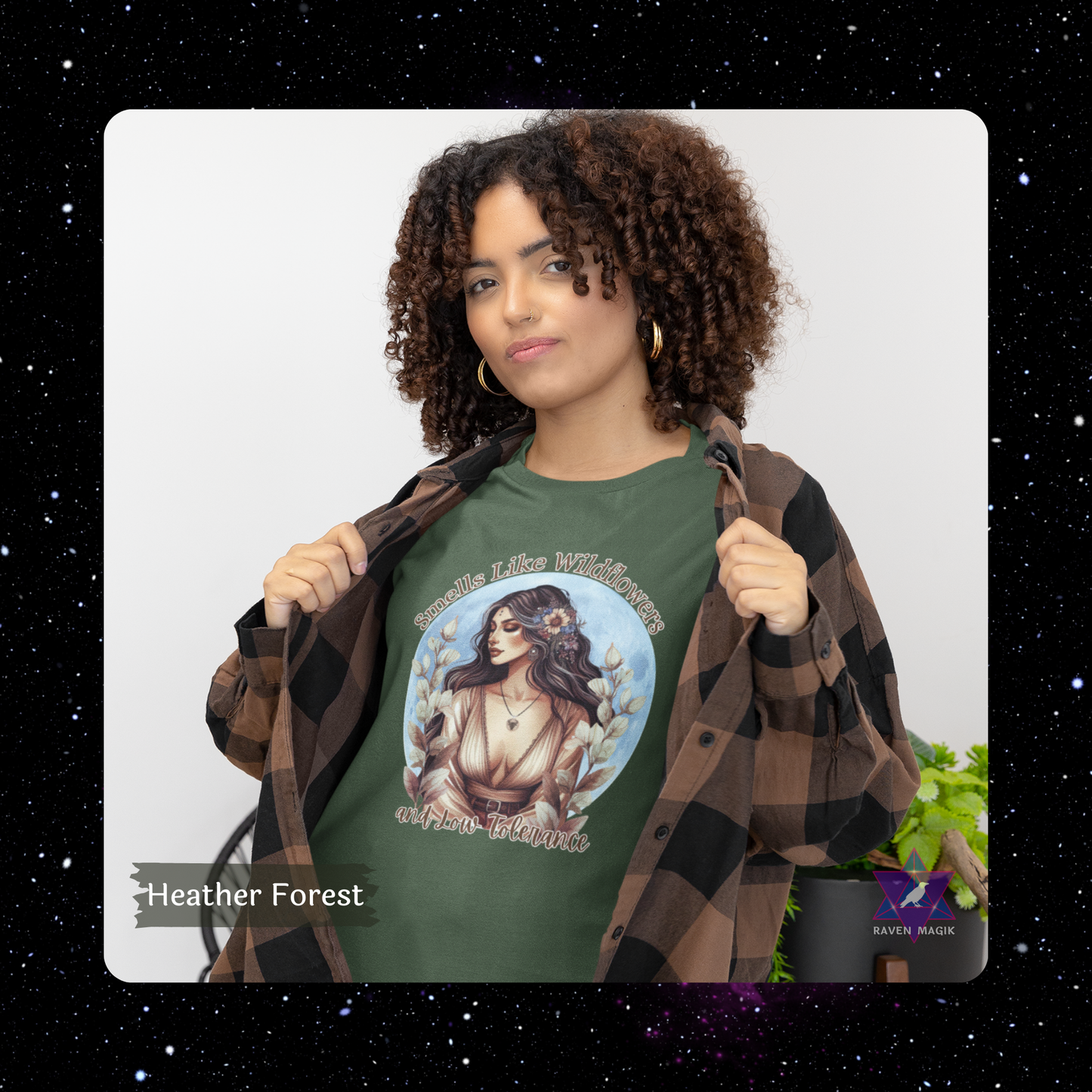 Woman wearing a green t-shirt with a graphic design, standing against a white background.